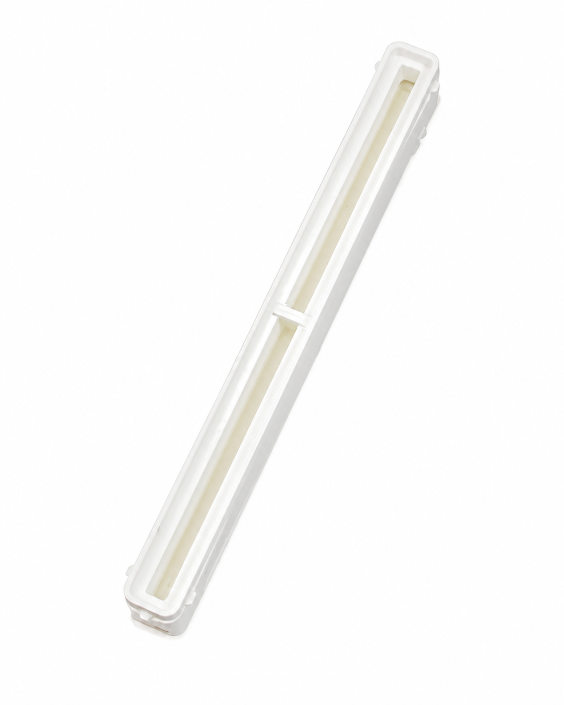 White 10.5 inch Bahne center fin box with integrated resin reservoir.