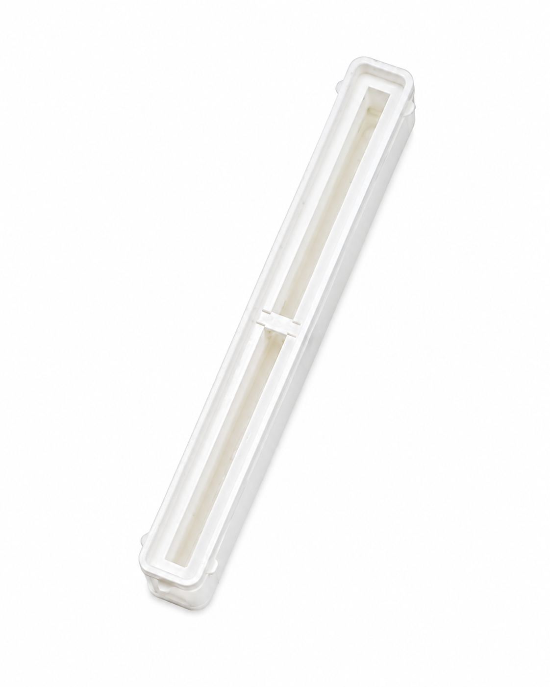 White 8.5 inch Bahne center fin box with integrated resin reservoir.