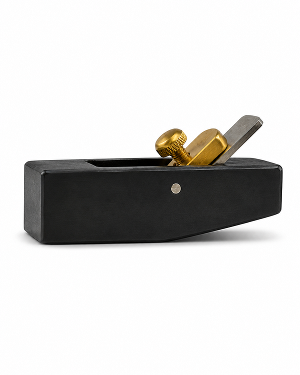 Curved Japanese hand plane for trimming surfboard stringers along the rocker