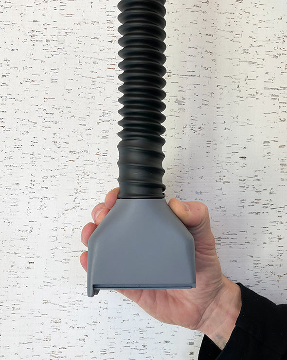 Skil 100 vacuum port connected to flexible surfboard planer dust collection hose